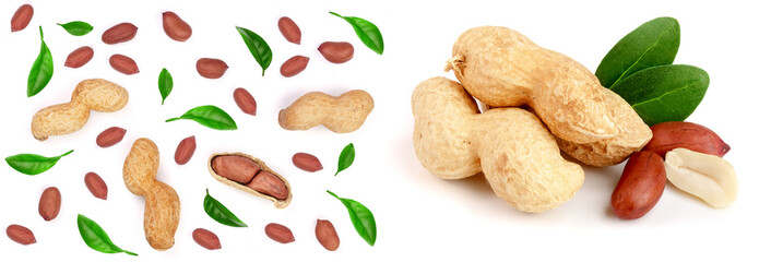 Peanuts decorated with green leaves isolated on white background, top view. Flat lay pattern