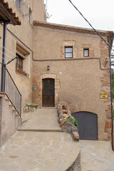 Old stone house with garage in the town of Mura, Catalonia