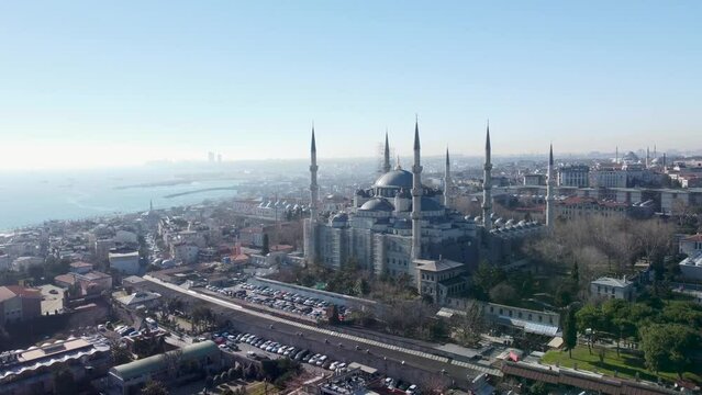 Blue Mosque, Sultan Ahmed Mosque, Wide Shot, Süleymaniye Mosque in distance, Istanbul Turkey, Taksim, Wide Angle, Pan right,  Opening Shot, Cinematic, 50mm Focal, Facing the Sea of Marmara