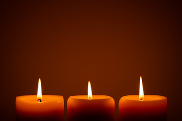Burning candles in the dark