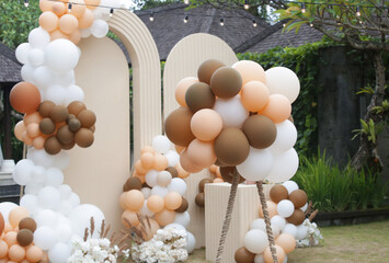 Creative gender neutral baby shower or birthday decoration in the garden. Bohemian style outdoor...