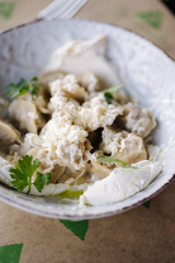Dumplings with sour cream and butter. Traditional food. 