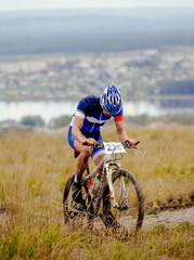 cyclist rider riding uphill on mountain bike cycling competition