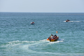 Tourist enjoying their motorboat ride at the beach in Gujarat India