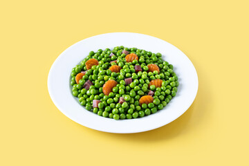 Green peas with serrano ham and carrot on yellow background