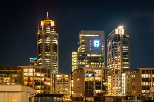 Amsterdam, The Netherlands, 08.02.2023, Modern skyscrapers in Amsterdam at night,  headquarters of dutch multinational corporation Philips at Breitner tower