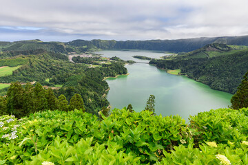 Lagoa Azul and Lagoa Verde volcanic lakes in Sao Miguel, Azores / In the interior of the island of Sao Miguel, the volcanic lakes Lagoa Azul, Lagoa Verde and the village of Sete Cidades. - 573495065