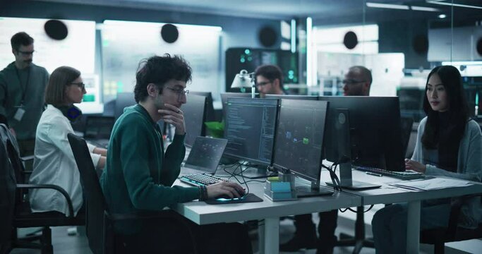 Team of Talented Young Professionals Working in a Technological Research and Development Facility. Diverse Specialists Using Computers, Writing Code, Planning Innovative Information Technology Project - Powered by Adobe