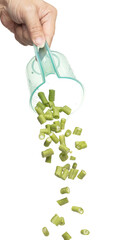 Chopped Long yard bean fly fall in measured cup, Cut green long beans for food cooking float in air. Raw slice long yard bean throw in mid air as food material. White background isolated high speed