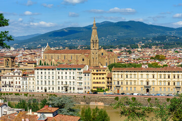 Fototapeta na wymiar Basilica of the Holy Cross (Santa Croce) and Florence architecture along Arno river, Italy