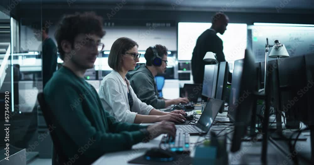 Fototapete Team of Diverse Multiethnic Software Developers Working on Computers, Developing Artificial Intelligence Projects. Specialist Putting On Headphones. Focus Switching to Another Creative Colleague
