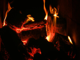 Burning coals from a fire abstract background. Hot coals in the fire
