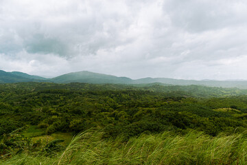 Fototapeta premium Gloomy clouds over the tropical mountains. Bulacan, Philippines