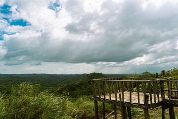 A fence on the hill overlooking a tropical valley. Bulacan, Philippines