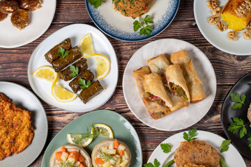 Ramadan table. Turkish food on wooden background. Iftar and sahur delicacies. Turkish oriental dishes. Types of appetizers. Top view