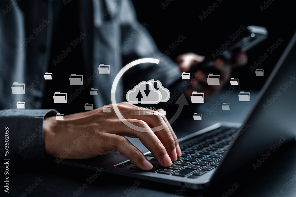 Fototapete Businessman using smartphone and laptop uploading to cloud computing to download and loading data information and upload on system network application. Technology transformation concept..