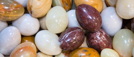 Marble Easter Eggs different colors, holiday banner background