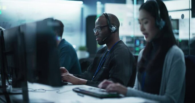 Positive Technical Support Manager Talking on a Call, Providing Help Desk Solutions to a Customer Experiencing Troubleshooting Issues with a Product. Happy African Man Successfully Solving the Problem
