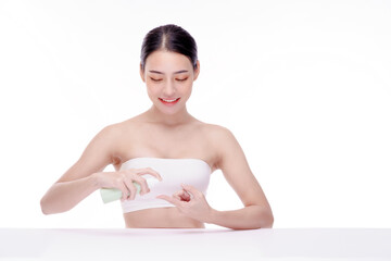 Woman pushing pump plastic cream bottle with copy space. using skin care moisturizer dispenser. Hygiene skin body care concept.