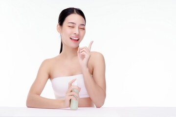 Woman pushing pump plastic cream bottle with copy space. using skin care moisturizer dispenser. Hygiene skin body care concept.