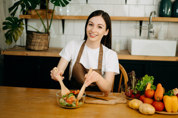 image of asian woman preparing salad in the kitchen and healthy  food in bowl e
