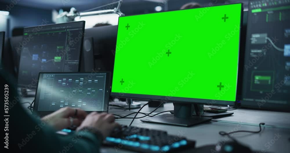 Leinwandbilder Close Up of a Software Developer Working on a Desktop Computer with Green Screen Mock Up Display. Specialist Typing on Keyboard, Coding and Implementing a New Technical Feature, Working in an Agency