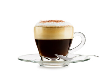 Cappuccino in glass cup with saucer and spoon on white background