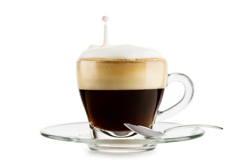 Cup of cappuccino with splashing milk on white background