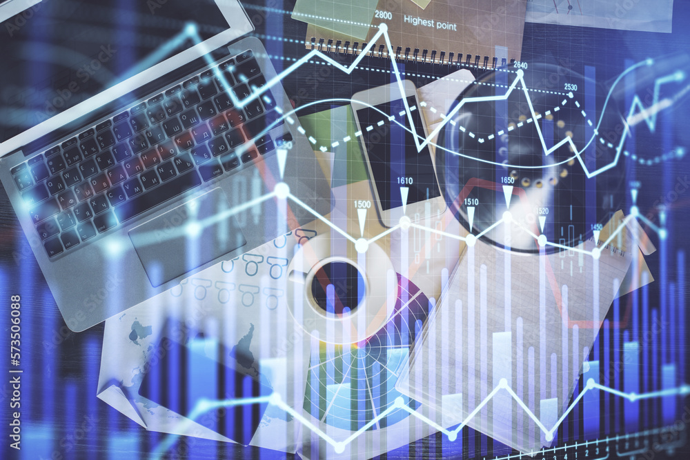 Poster Financial market graph and top view computer on the desktop background. Multi exposure. Investment concept.