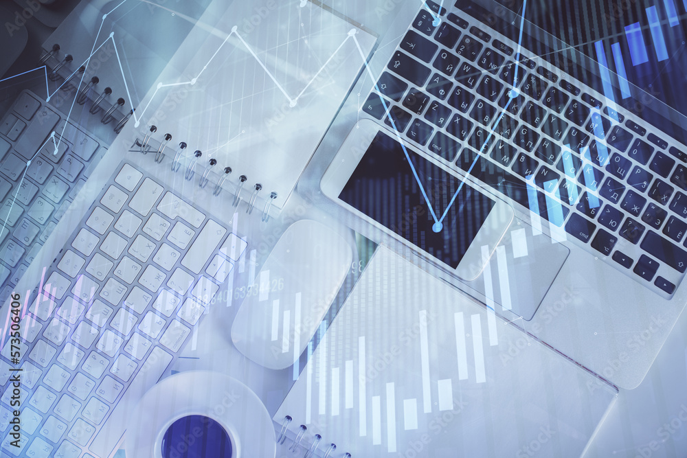 Poster financial market graph and top view computer on the desktop background. multi exposure. investment c