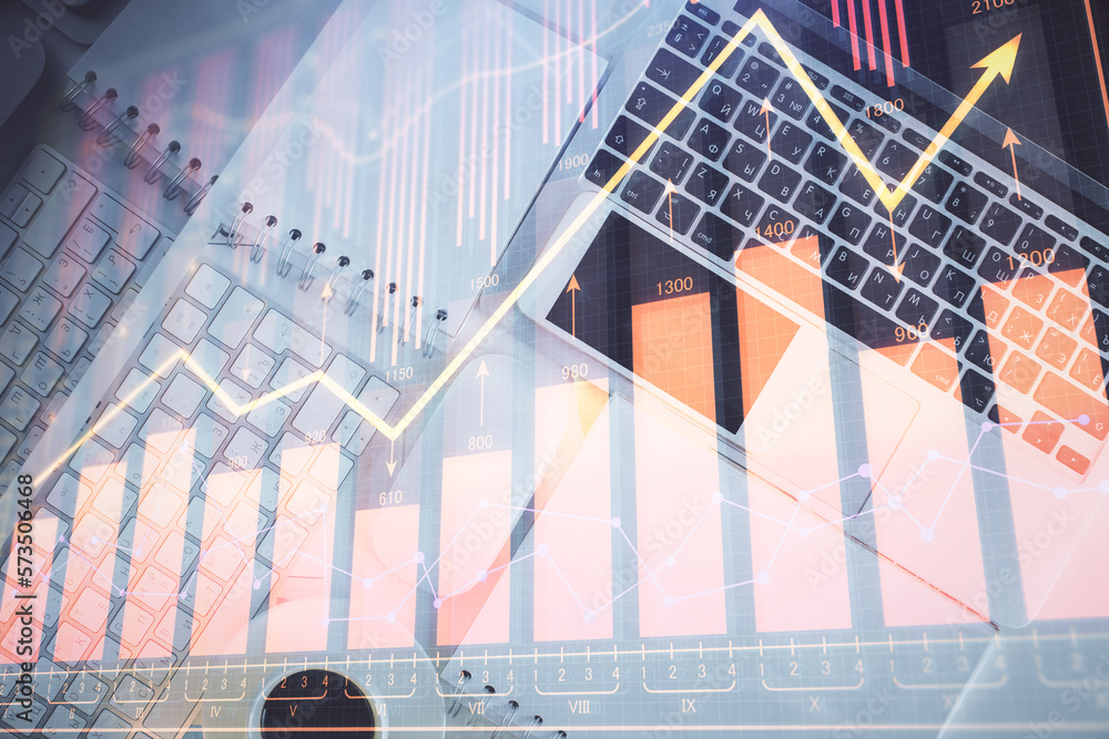 Poster financial market graph and top view computer on the desktop background. multi exposure. investment c