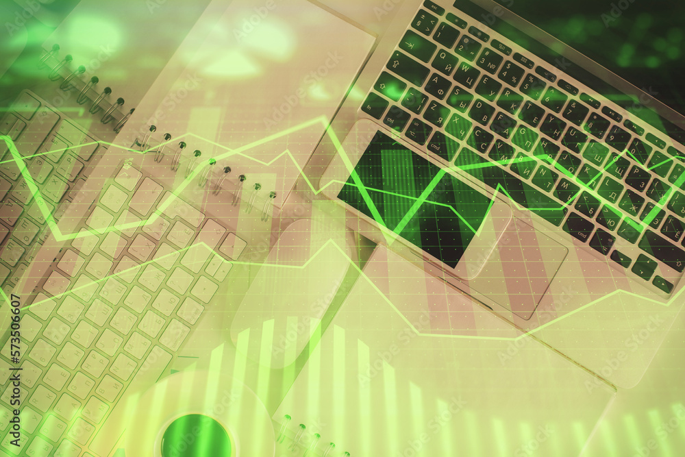 Poster financial market graph and top view computer on the desktop background. multi exposure. investment c