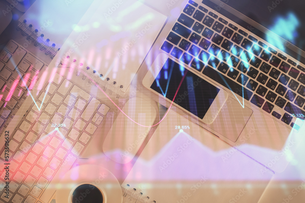 Poster financial market graph and top view computer on the desktop background. multi exposure. investment c
