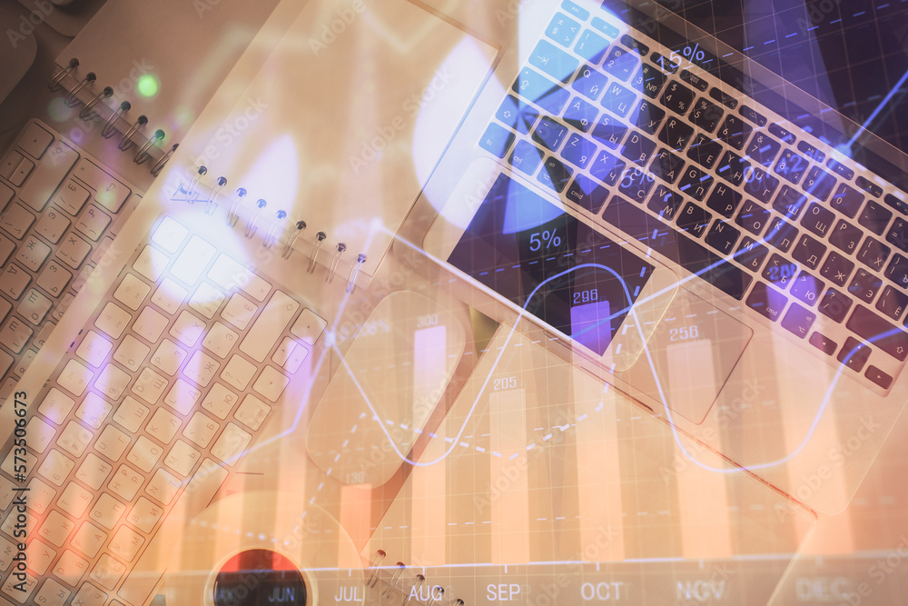 Poster Financial market graph and top view computer on the desktop background. Multi exposure. Investment concept.