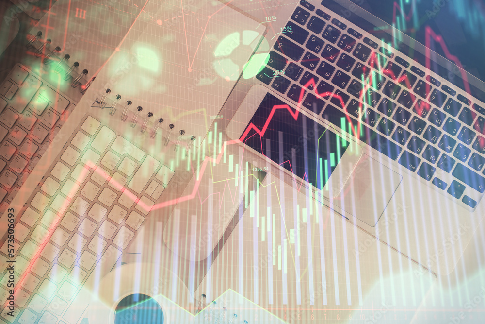 Poster Financial market graph and top view computer on the desktop background. Multi exposure. Investment concept.