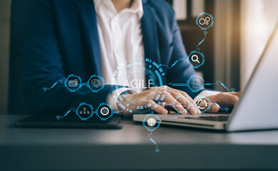 Agile development methodology concept. Business hand using laptop computer and tablet with virtual...