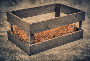 Empty wooden box on grunge background. Vintage style toned picture