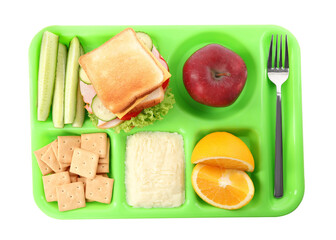 Serving tray with tasty healthy food isolated on white, top view. School dinner