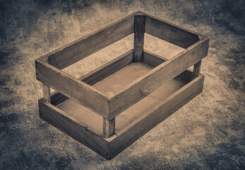 Empty wooden box on grunge background. Vintage style toned picture