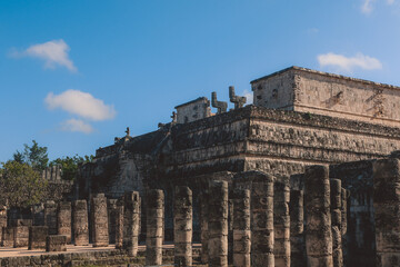 Fototapeta premium Remains of an Ancient Ruins of the large pre-Columbian city Chichen Itza, built by the Maya people, Mexico