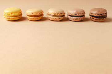 Pastel shades french macarons or macaroons (almond cookies) on the  background. Copy space for text