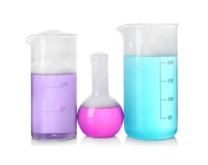 Laboratory glassware with colorful liquids isolated on white. Chemical reaction