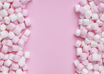 Delicious marshmallows on pink background, flat lay. Space for text