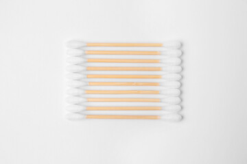 Many clean cotton buds isolated on white, top view