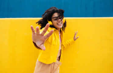 Young happy woman dancing and having fun outdoor.