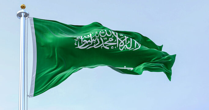 Saudi Arabia national flag waving in the wind on a clear day