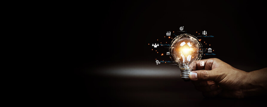 Close up hand choose light bulb or lamp with bright light for human resources or leadership and creativity thinking idea motivation or vision and knowledge learning and study or education concept.