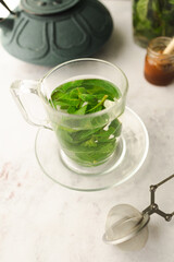 Tea with fresh mint leaves. Mint infusion helps with digestive problems
