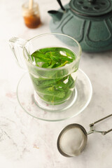 Tea with fresh mint leaves. Mint infusion helps with digestive problems