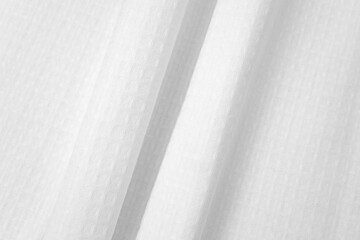 Obraz premium White textured cotton fabrics swatches on light background. Layered Textile Mockup